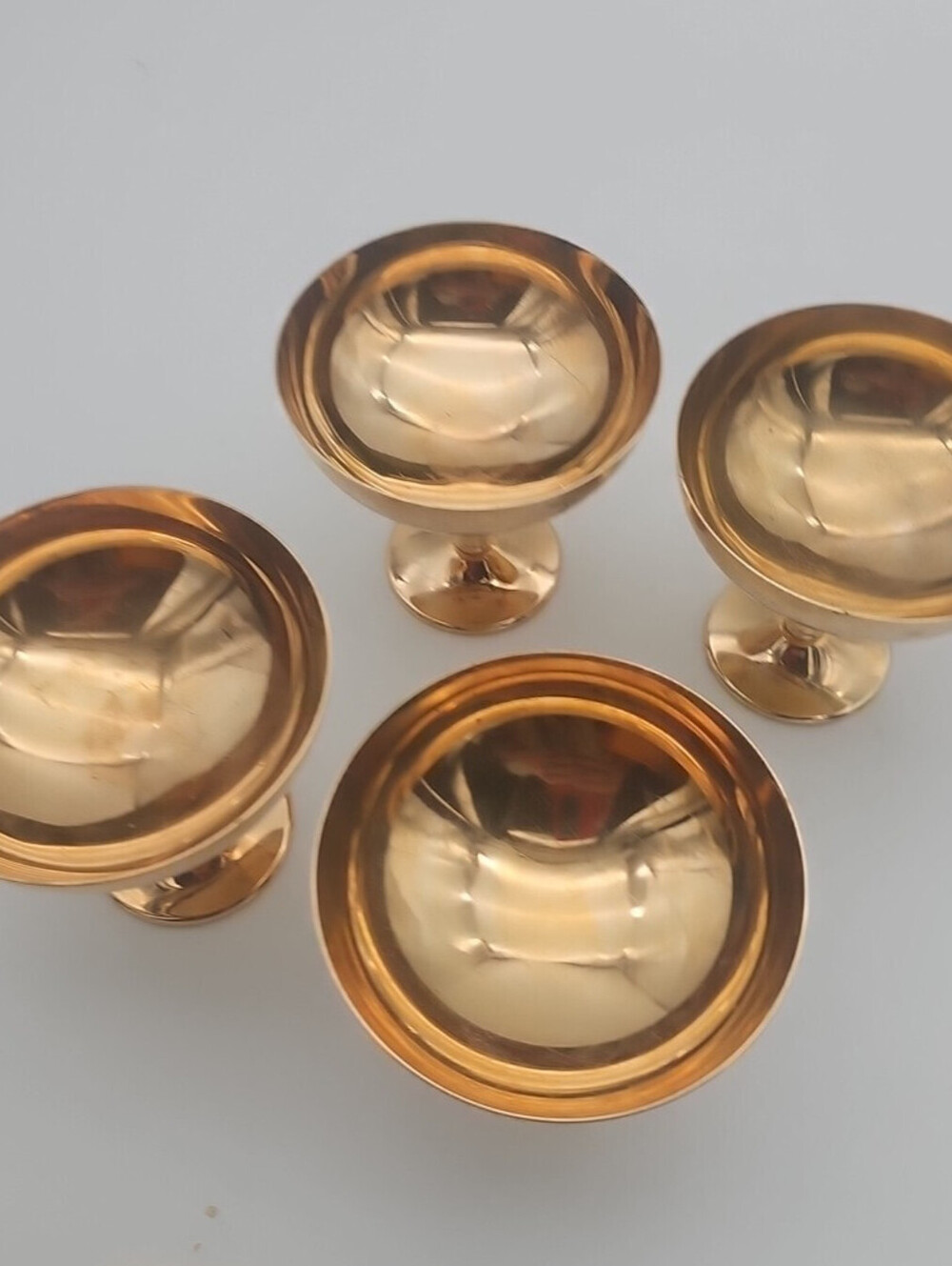 Four polished mid-century compote cups. Sturdy metal pedestal. Good Condition